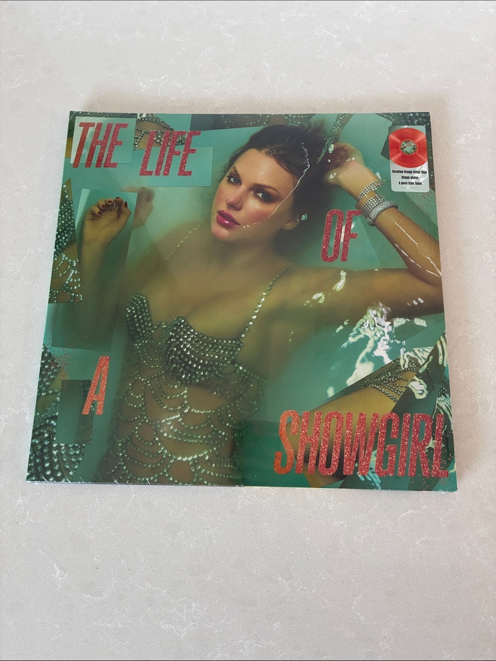 Taylor Swift Vinyl Record with Green Teal Cover and Red Text